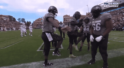 Football Players Number 66 On Field GIF