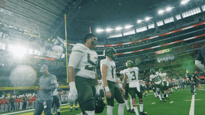 Football Players On Field In Front Of Pepsi Ad GIF