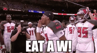 Football Players On Field Saying Eat A W GIF