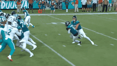 Football Players On Field With Number 135 GIF