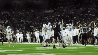 Football Players On Field With Number 16 Jersey GIF