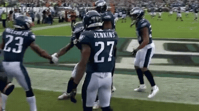 Football Players On Field With Number 27 GIF