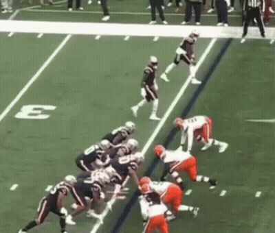 Football Players On Field With Sideline Letter E GIF