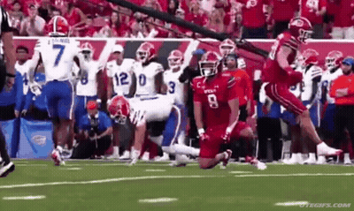 Football Players Playing Game With Referee GIF