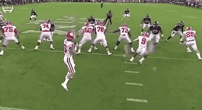 Football Players Playing On Field In Stadium GIF