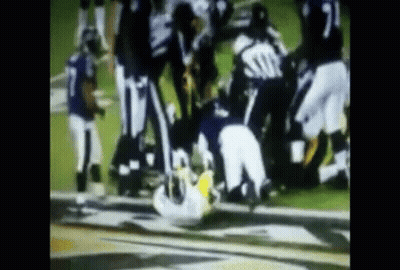 Football Players Playing One Lying On Ground GIF