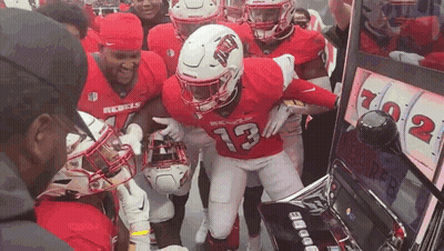 Football Players Playing Slot Machine Number 13 Jersey GIF