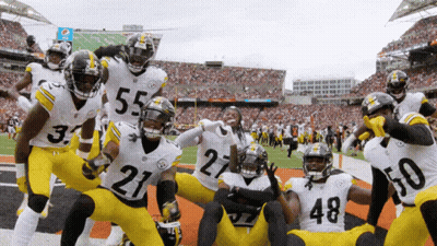 Football Players Posing With Number 21 GIF