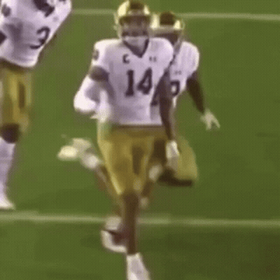 Football Players Running With Number 1429 Jersey GIF