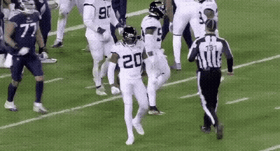 Football Players Running With Referee GIF