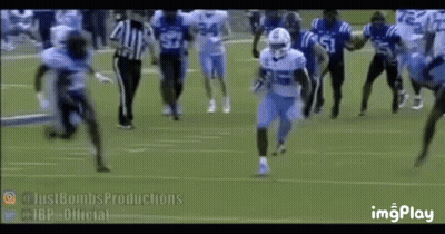 Football Players Running With Referee Watching GIF