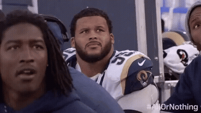 Football Players Sitting In Stadium GIF