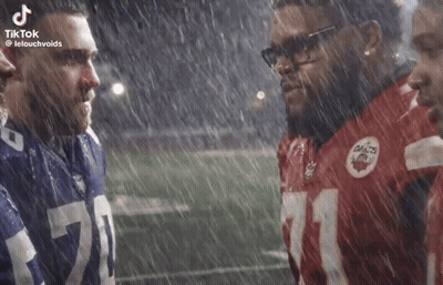 Football Players Standing In Rain GIF
