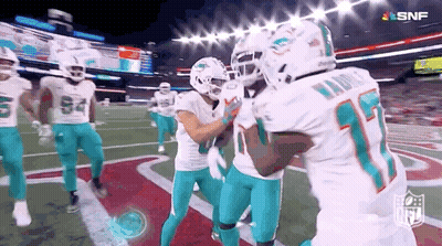 Football Players Standing On Field GIF