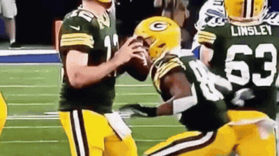 Football Players Standing On Field GIF