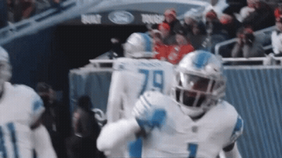 Football Players Standing On Field GIF