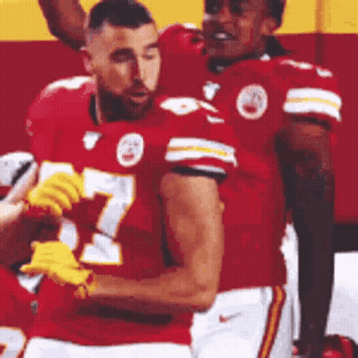 Football Players Standing On Field GIF