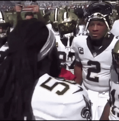 Football Players Standing On Field GIF