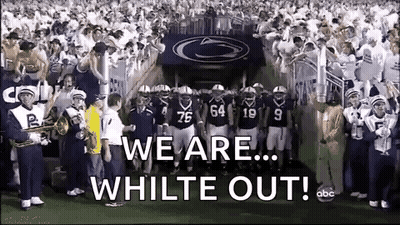 Football Players Standing On Field With Band GIF