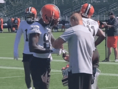 Football Players Standing On Field With Number 23 Shirt GIF
