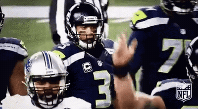 Football Players Standing On Field With Referee GIF