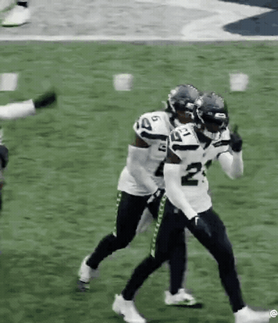 Football Players Standing On Football Field GIF
