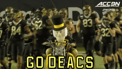 Football Players Walking On Field Saying Go Deacs GIF