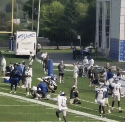 Football Players With Blue Truck Saying Blumac GIF