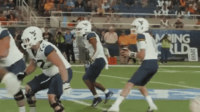 Football Players With Rising World Banner GIF