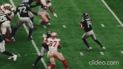 Football Thrown In Front Of To Lumen Banner GIF