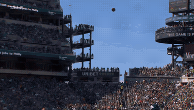 Football Thrown In Stadium With Banner Saying This Game Is GIF
