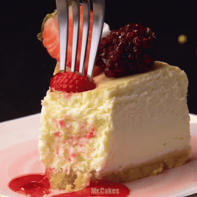 Fork Eating Cheesecake Slice With Raspberries GIF