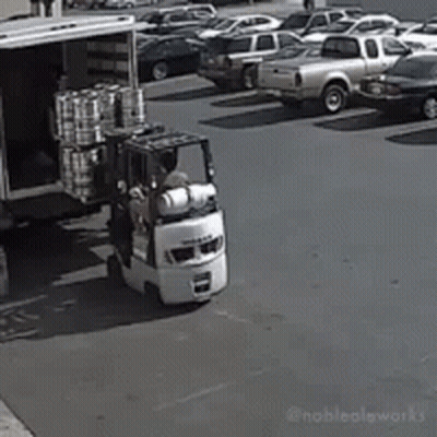 Forklift Loading Truck With Cans GIF