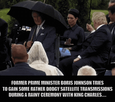 Former Prime Minister Boris Johnson Tries To Gain Some Rather Dodgy Satellite Transmissions During A Rainy Ceremony With GIF