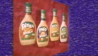 Four Bottles Of Pizza Ranch And Taco Ranch Are Lined Up GIF