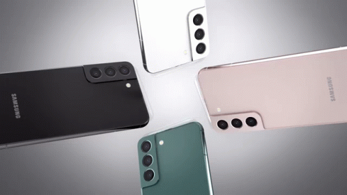 Four Different Colored Samsung Phones Are Laying On A Table GIF