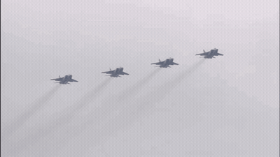 Four Fighter Jets Flying With Smoke Trails GIF