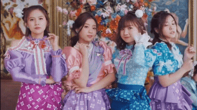 Four Girls Posing For Picture In Front Of Painting GIF