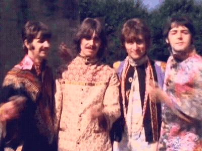 Four Men In Colorful Shirts Standing Together GIF