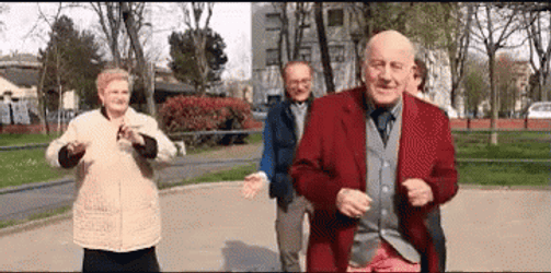 Four Old People Dancing In The Park GIF