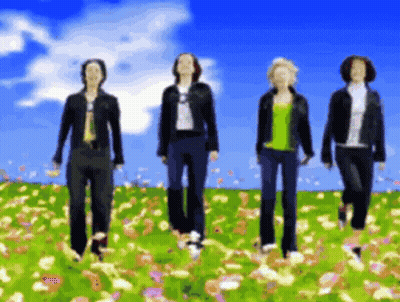 Four People Walking In Flower Field Blue Sky GIF