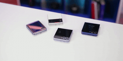 Four Phones On A Table One Of Which Has The Time Of 11:29 On It GIF