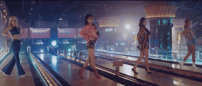 Four Women Are Walking Down A Bowling Alley GIF