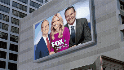 Fox & Friends Billboard With Woman And Two Men GIF
