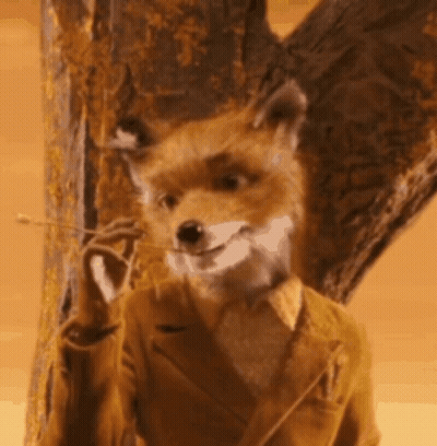 Fox In Suit Standing Next To Tree Smiling GIF