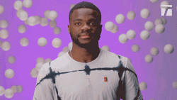 Francis Tiafoe Showing Off Muscles GIF