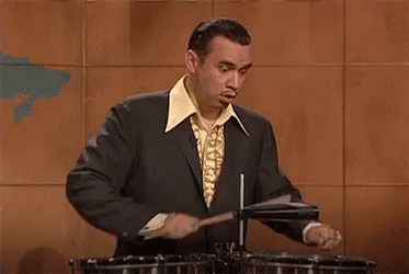 Fred Armisen Holding Rim Shot Stick GIF