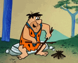 Fred Flintstones Making Campfire GIF