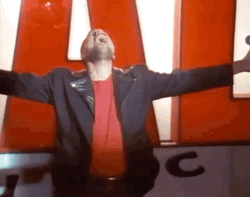 Freddie Mercury Spreading His Arms GIF