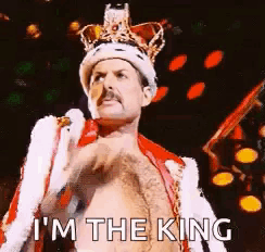 Freddie Mercury Wearing Crown And Coat GIF